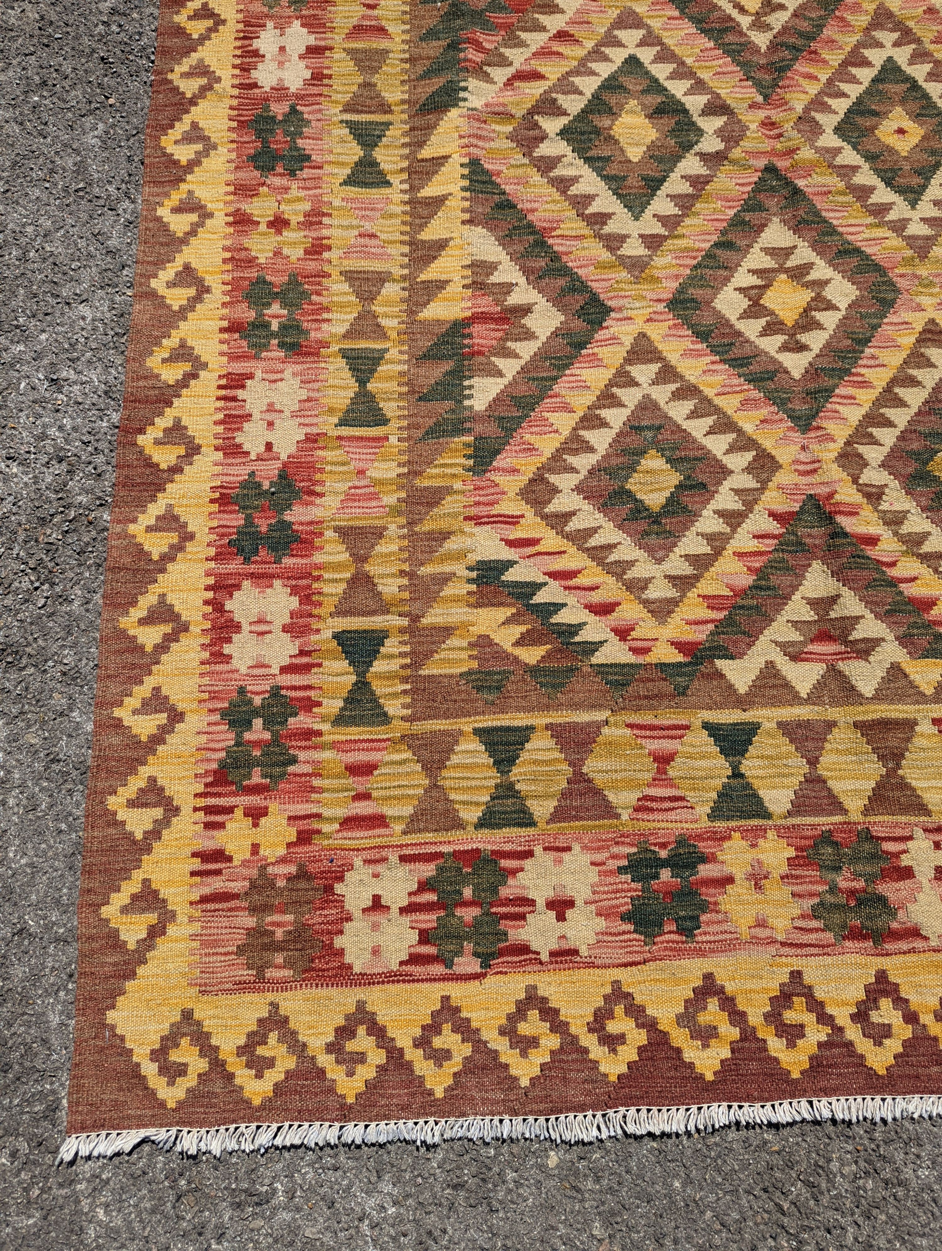 An Anatolian design polychrome geometric flatweave Kilim rug, 215 x 157cm